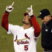 Pujols points to the sky